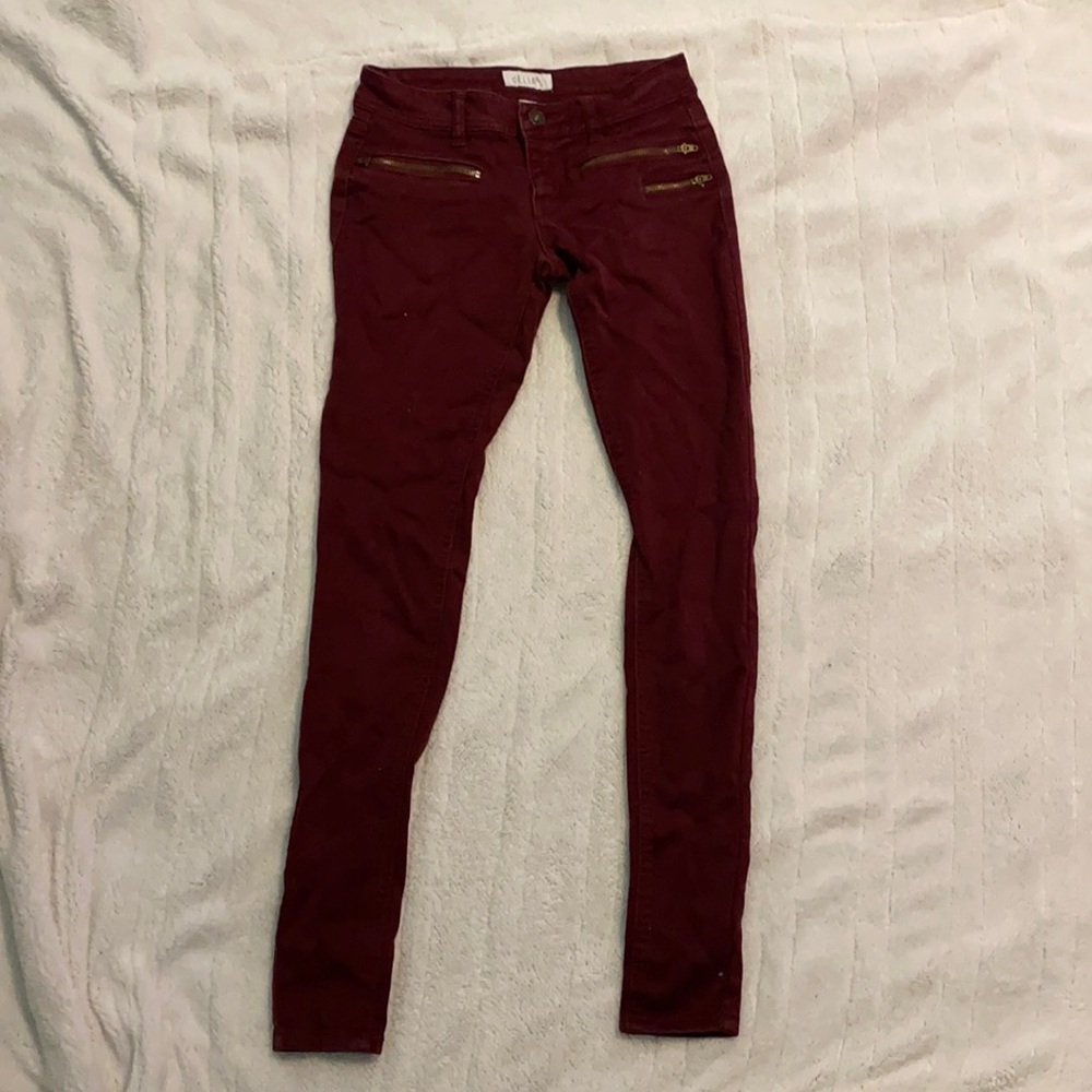 Delia’s maroon skinny jeans